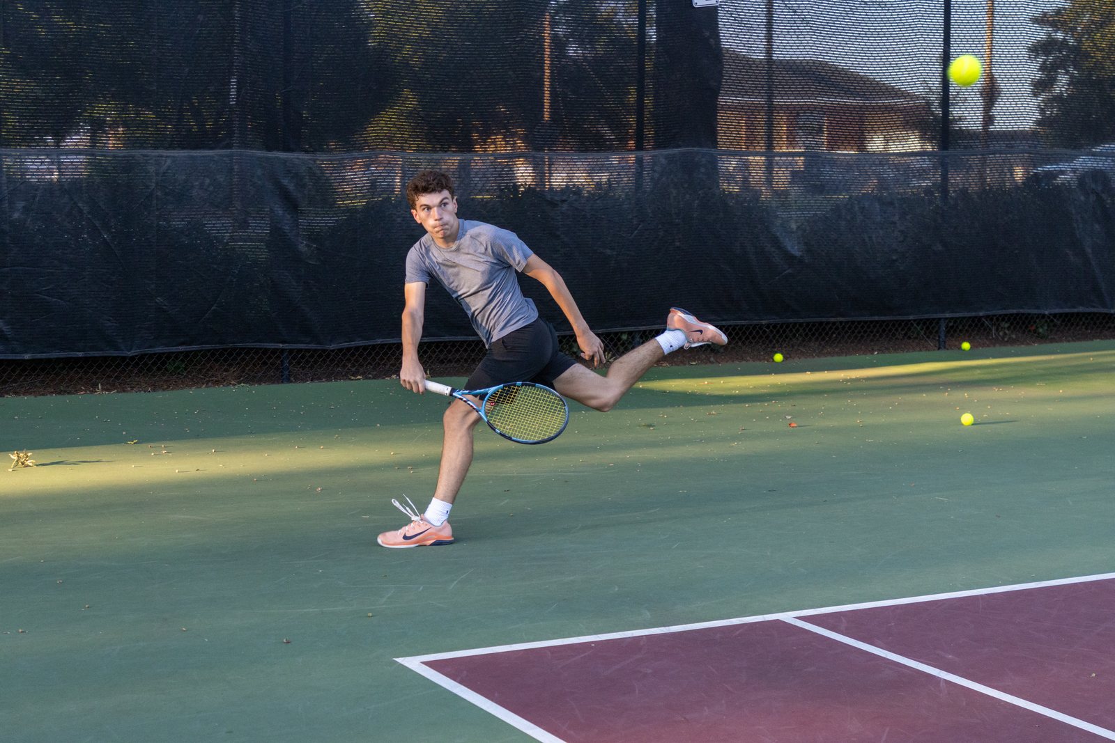Elon Club Tennis player hitting a forehand