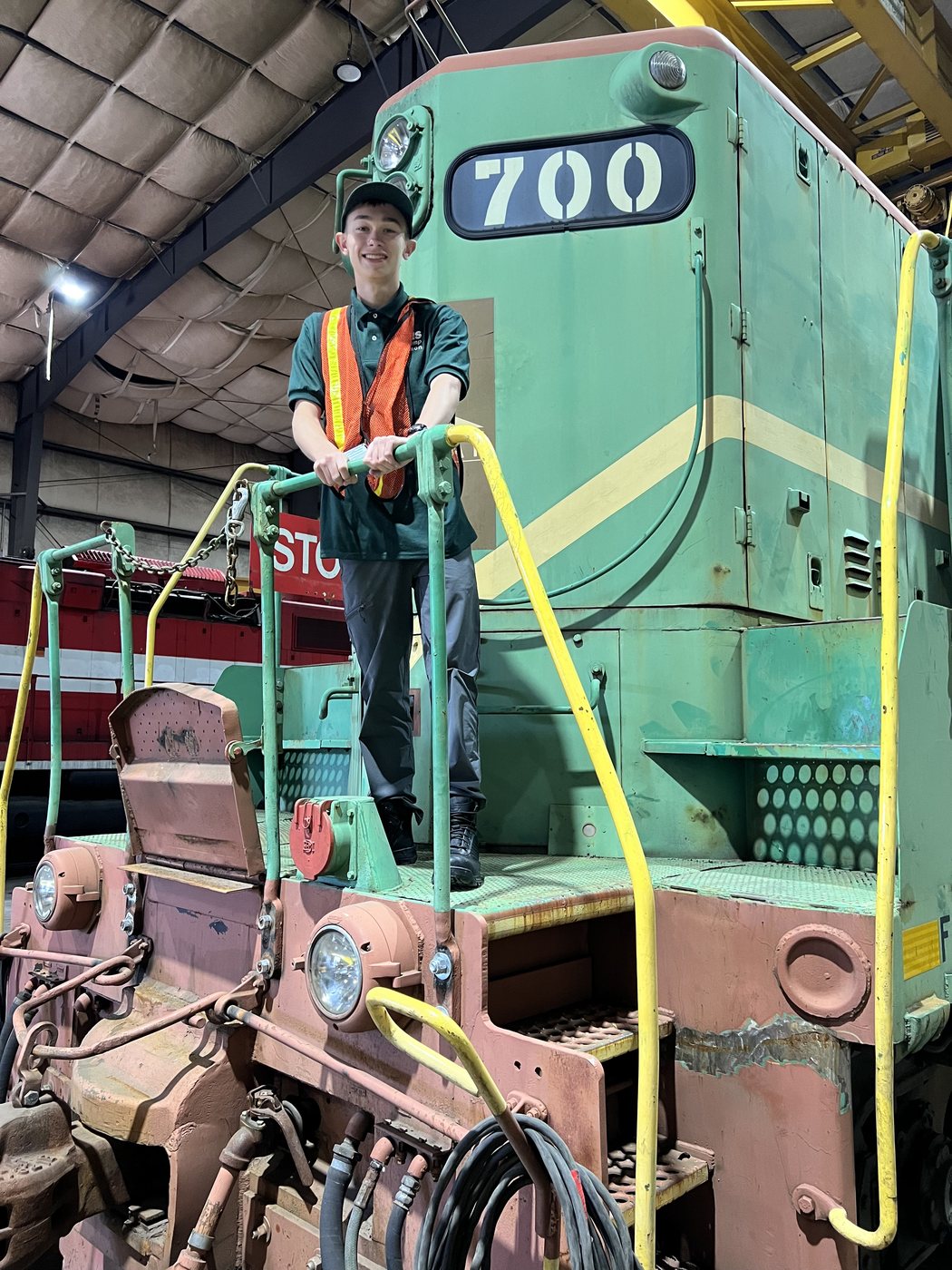 Harrison R. Mitchell on a locomotive during a supervised shop visit at NRHS RailCamp